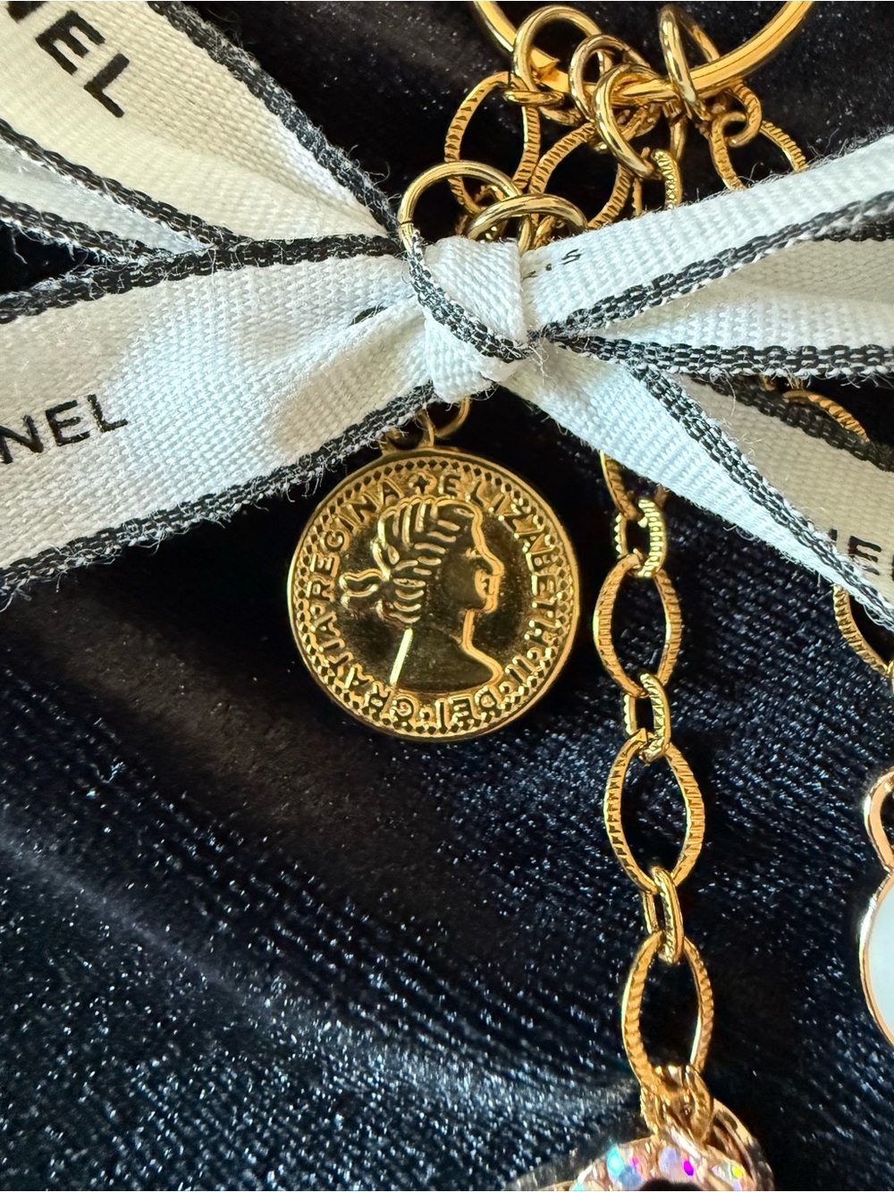 ChaneI Gold-Tone Keyring with White Ribbon and Black Logo and Gold Charms - Picture 8 of 10